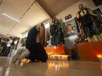 A faithful attends the temple of Santa Muerte in the municipality of Pedro Escobedo, Mexico, on November 1, 2024, to worship her and give th...