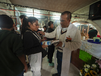 A faithful attends the temple of Santa Muerte in the municipality of Pedro Escobedo, Mexico, on November 1, 2024, to worship her and give th...