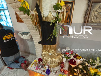 An image of Santa Muerte is seen inside the temple in the municipality of Pedro Escobedo during the annual celebrations. Every year on Novem...