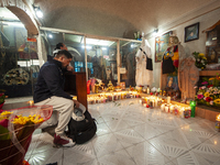 A faithful attends the temple of Santa Muerte in the municipality of Pedro Escobedo, Mexico, on November 1, 2024, to worship her and give th...