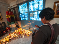 A faithful attends the temple of Santa Muerte in the municipality of Pedro Escobedo, Mexico, on November 1, 2024, to worship her and give th...