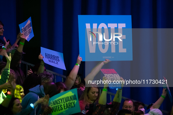 People cheer Vice President Kamala Harris at a get out the vote rally in Harrisburg, PA, on October 30, 2024.  Harris and her running mate,...