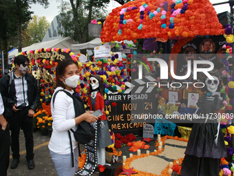 People attend the twenty-seventh edition of the University Day of the Dead Festival ''Mega Ofrenda UNAM 2024, Mexico Seen Through the Lens,'...