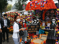 People attend the twenty-seventh edition of the University Day of the Dead Festival ''Mega Ofrenda UNAM 2024, Mexico Seen Through the Lens,'...