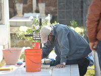 A person decorates the graves of his loved ones with cempasuchil flowers and holds a vigil at the Municipal Cemetery of Amealco de Bonfil. A...