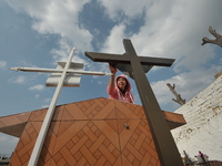 A person decorates the graves of her loved ones with cempasuchil flowers and holds a vigil at the Municipal Cemetery of Amealco de Bonfil. A...