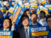 Democratic Party leader Lee Jae-myung (center), along with opposition lawmakers and tens of thousands of party members, holds a rally speech...