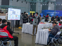 Visitors watch a robot perform at the China Robot Competition in Xi'an, China, on November 2, 2024. (