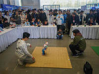 Visitors watch a robot perform at the China Robot Competition in Xi'an, China, on November 2, 2024. (