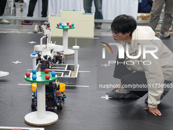 Visitors watch a robot perform at the China Robot Competition in Xi'an, China, on November 2, 2024. (