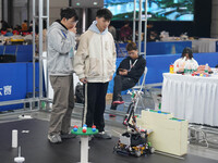 Visitors watch a robot perform at the China Robot Competition in Xi'an, China, on November 2, 2024. (