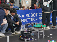 Visitors watch a robot perform at the China Robot Competition in Xi'an, China, on November 2, 2024. (