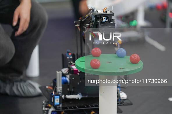 Visitors watch a robot perform at the China Robot Competition in Xi'an, China, on November 2, 2024. 