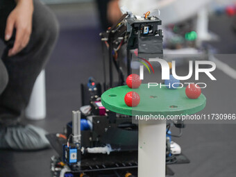 Visitors watch a robot perform at the China Robot Competition in Xi'an, China, on November 2, 2024. (