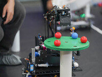 Visitors watch a robot perform at the China Robot Competition in Xi'an, China, on November 2, 2024. (