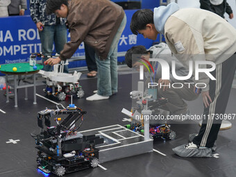 Visitors watch a robot perform at the China Robot Competition in Xi'an, China, on November 2, 2024. (