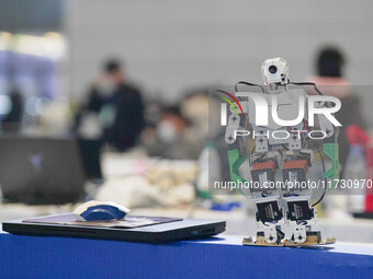 Visitors watch a robot perform at the China Robot Competition in Xi'an, China, on November 2, 2024. (