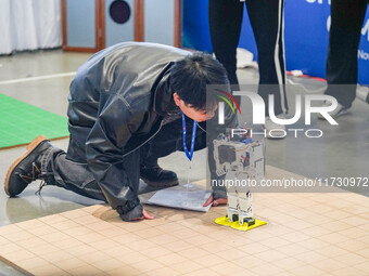 Visitors watch a robot perform at the China Robot Competition in Xi'an, China, on November 2, 2024. (