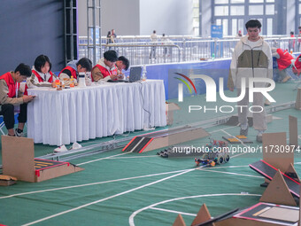 Visitors watch a robot perform at the China Robot Competition in Xi'an, China, on November 2, 2024. (