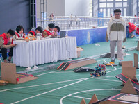 Visitors watch a robot perform at the China Robot Competition in Xi'an, China, on November 2, 2024. (