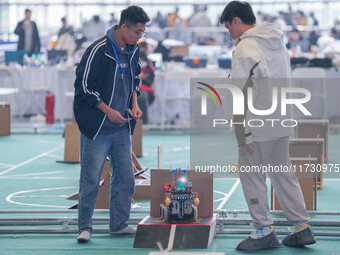 Visitors watch a robot perform at the China Robot Competition in Xi'an, China, on November 2, 2024. (