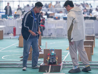 Visitors watch a robot perform at the China Robot Competition in Xi'an, China, on November 2, 2024. (