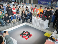 Visitors watch a robot perform at the China Robot Competition in Xi'an, China, on November 2, 2024. (