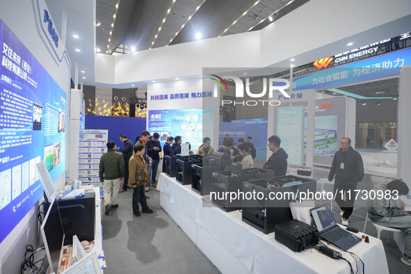 Visitors watch a robot perform at the China Robot Competition in Xi'an, China, on November 2, 2024. 