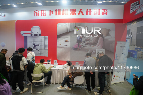 Visitors watch a robot perform at the China Robot Competition in Xi'an, China, on November 2, 2024. 