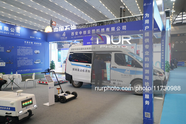 Visitors watch a robot perform at the China Robot Competition in Xi'an, China, on November 2, 2024. 