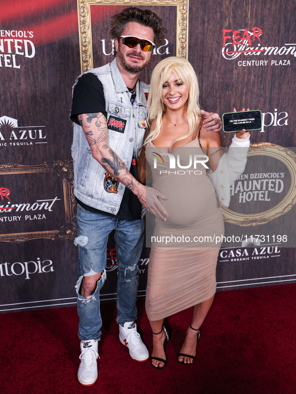 Ian Passmore and Rio Sage arrive at Darren Dzienciol's Haunted Hotel Halloween Party 2024 presented by UTOPIA and Casa Azul Organic Tequila...