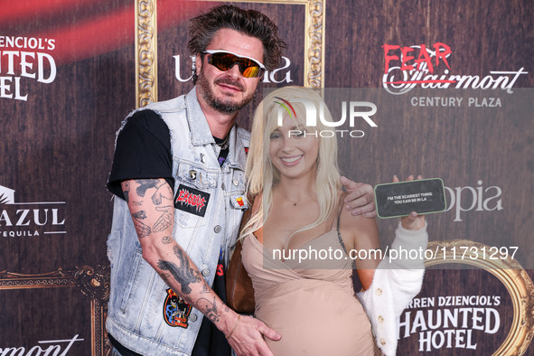 Ian Passmore and Rio Sage arrive at Darren Dzienciol's Haunted Hotel Halloween Party 2024 presented by UTOPIA and Casa Azul Organic Tequila...