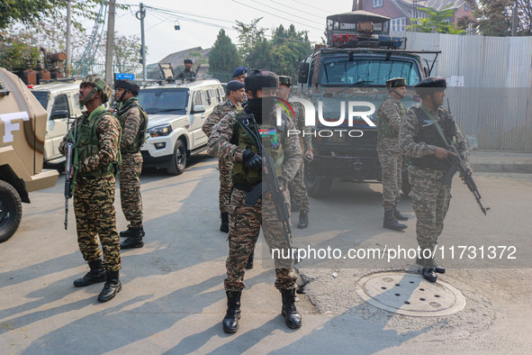 An Indian security personnel stands guard near the site of a gunbattle between suspected militants and security forces in Srinagar, Jammu an...