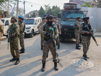 An Indian security personnel stands guard near the site of a gunbattle between suspected militants and security forces in Srinagar, Jammu an...