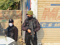 An Indian security personnel stands guard near the site of a gunbattle between suspected militants and security forces in Srinagar, Jammu an...