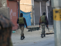 Indian paramilitary troopers carry a stretcher near the encounter site in Srinagar, Indian Administered Kashmir, on November 2, 2024. Three...