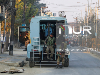 Indian paramilitary troopers remain alert near the encounter site in Srinagar, Indian Administered Kashmir, on November 2, 2024. Three milit...