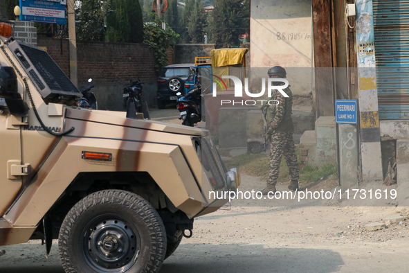 Indian paramilitary troopers remain alert near the encounter site in Srinagar, Indian Administered Kashmir, on November 2, 2024. Three milit...