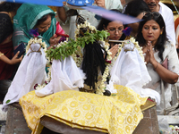 Hindu devotees participate in the 'Annakut' or 'Govardhan Puja' festival at the Madan Mohan temple in Kolkata, India, on November 2, 2024. G...