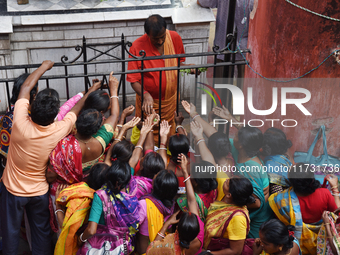 Hindu devotees participate in the 'Annakut' or 'Govardhan Puja' festival at the Madan Mohan temple in Kolkata, India, on November 2, 2024. G...