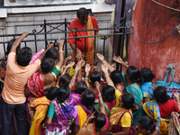 Hindu devotees participate in the 'Annakut' or 'Govardhan Puja' festival at the Madan Mohan temple in Kolkata, India, on November 2, 2024. G...