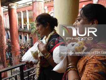 Shashi Panja, Minister of Women and Child Development and Social Welfare of West Bengal, and her daughter Puja Panja participate in the Anna...