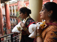 Shashi Panja, Minister of Women and Child Development and Social Welfare of West Bengal, and her daughter Puja Panja participate in the Anna...