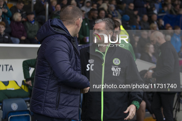 Forest Green manager Steve Cotterill and Stockport County manager Dave Challinor shake hands during the FA Cup First Round match between Sto...