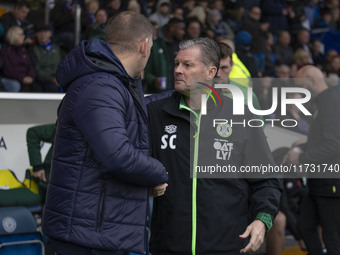 Forest Green manager Steve Cotterill and Stockport County manager Dave Challinor shake hands during the FA Cup First Round match between Sto...