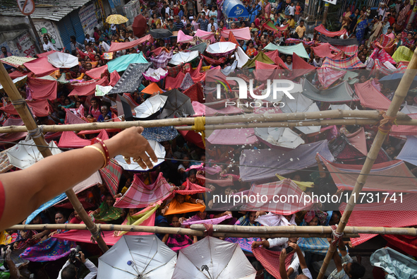 Hindu devotees participate in the 'Annakut' or 'Govardhan Puja' festival at the Madan Mohan temple in Kolkata, India, on November 2, 2024. G...