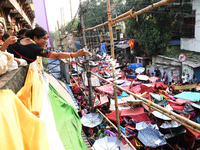 Shashi Panja, Minister of Women and Child Development and Social Welfare of West Bengal, and Indian devotees collect holy rice during the An...