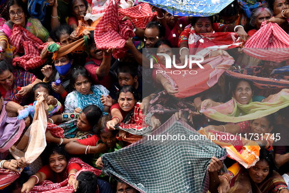 Hindu devotees participate in the 'Annakut' or 'Govardhan Puja' festival at the Madan Mohan temple in Kolkata, India, on November 2, 2024. G...