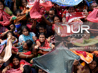 Hindu devotees participate in the 'Annakut' or 'Govardhan Puja' festival at the Madan Mohan temple in Kolkata, India, on November 2, 2024. G...