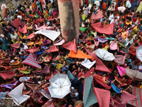 Indian devotees collect holy rice during the Annakut Utsav (Govardhan Puja) at Madan Mohon Mandir in Kolkata, India, on November 2, 2024. Pe...